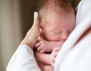 cuddle-new-born-baby